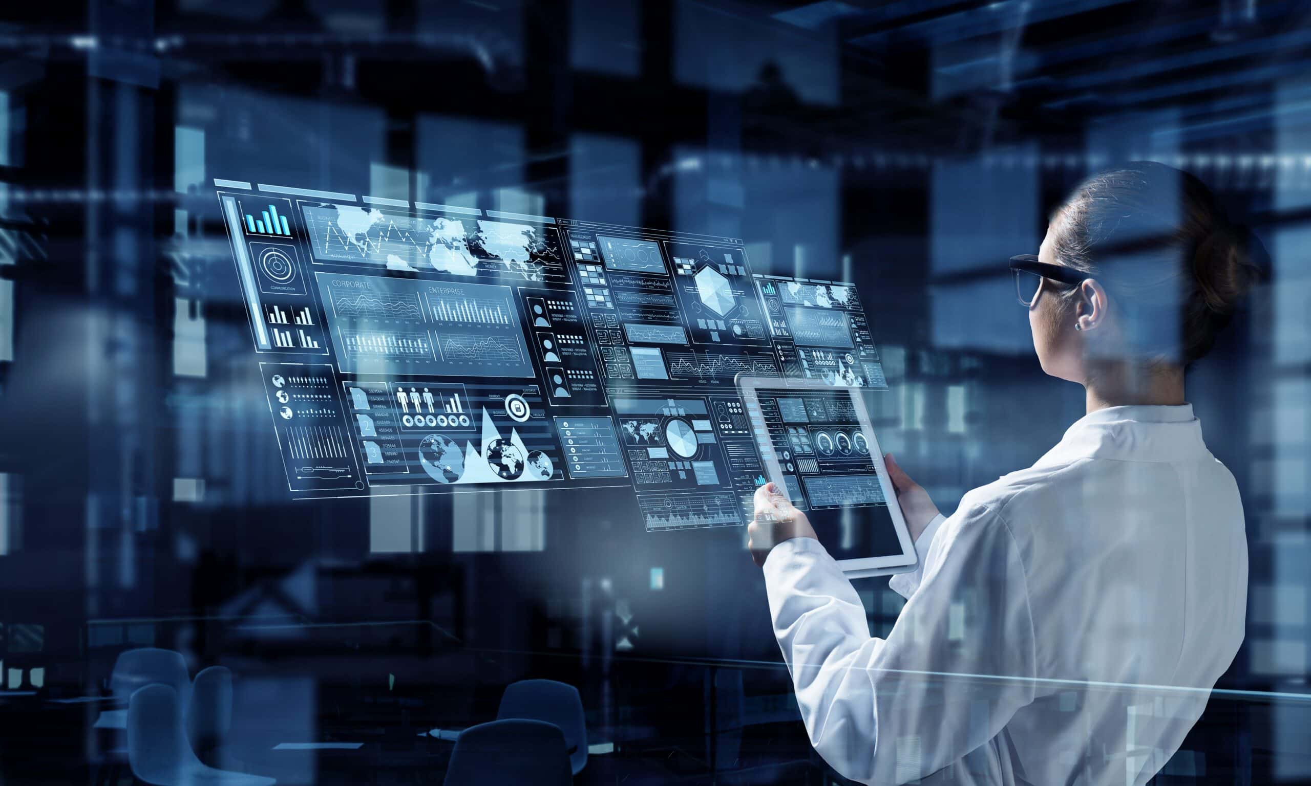 A woman in a lab coat and glasses stands in a futuristic setting, interacting with a large transparent screen displaying data charts and maps.